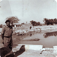 Brig. Hari Singh standing at Ichhogil Canal just 14 Miles from Lahore (Pakistan)